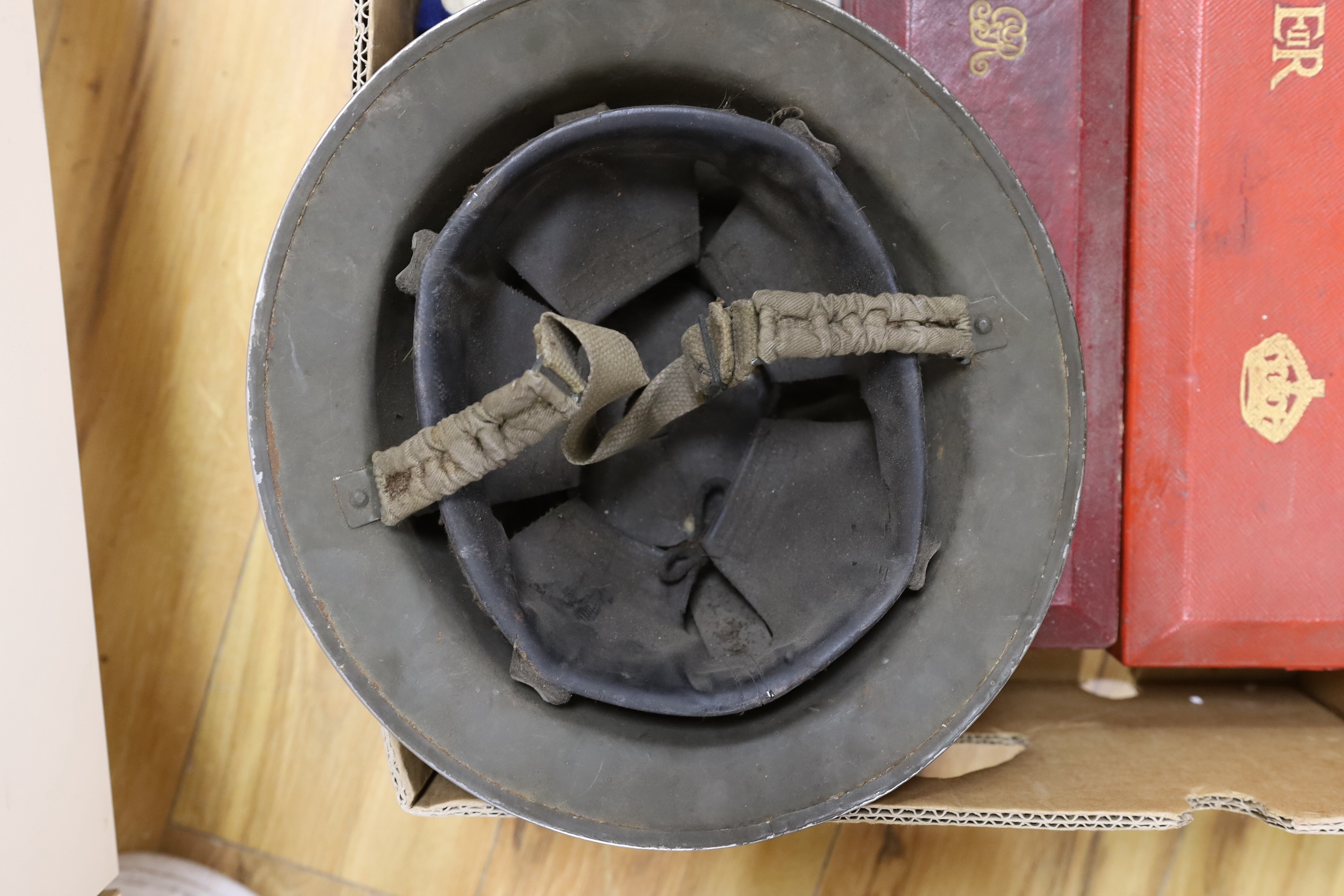 A collection of militaria, including; a pair of First World War military leather boots with wooden boot stretchers, two scroll boxes with Royal Cyphers for George V and Elizabeth II, a four draw telescope, a large union